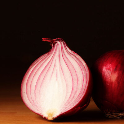 Half of a red onion and a whole red onion