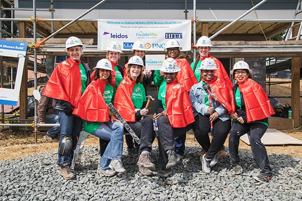 Freddie Mac women participate in a Habitat for Humanity of Northern Virginia Women Build to support the local community.